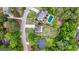 Bird's-eye view of a house with a swimming pool and a spacious backyard, surrounded by trees at 150 Rockspray Rdg, Peachtree City, GA 30269