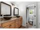 Bathroom with double vanity and vessel sinks, leading to toilet and shower at 150 Rockspray Rdg, Peachtree City, GA 30269