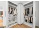 Organized walk-in closet with shelving, hanging rods, and drawers for storage at 150 Rockspray Rdg, Peachtree City, GA 30269