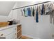 Organized closet featuring hanging clothes, a dresser with drawers, and storage baskets at 150 Rockspray Rdg, Peachtree City, GA 30269