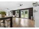 Bright living area boasts wood floors, ceiling fan, and access to the outdoors through glass doors at 150 Rockspray Rdg, Peachtree City, GA 30269
