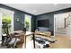 Modern home office with stylish decor, ample natural light, and wood flooring at 150 Rockspray Rdg, Peachtree City, GA 30269