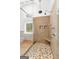 The spacious shower features glass doors, a built in bench, and a window at 150 Rockspray Rdg, Peachtree City, GA 30269