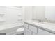 Bright bathroom featuring a tub-shower combo and a modern vanity with a speckled countertop at 281 Limestone Circle, Conyers, GA 30013