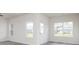 Bright room showcasing wood-look floors, white trim, and ample natural light at 281 Limestone Circle, Conyers, GA 30013
