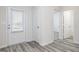 Welcoming foyer featuring elegant wood floors, a white door with blinds, and neutral paint at 281 Limestone Circle, Conyers, GA 30013