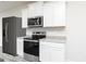 Kitchen features stainless steel appliances, granite countertops, and white cabinets at 281 Limestone Circle, Conyers, GA 30013