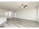 Bright and spacious living area with wood-look flooring and a ceiling fan at 281 Limestone Circle, Conyers, GA 30013