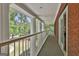 Spacious balcony with white columns overlooking lush greenery, providing a serene outdoor space at 602 Embassy Ct, Peachtree City, GA 30269
