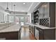 Wet bar features marble counters, stainless steel appliances, and backyard access at 602 Embassy Ct, Peachtree City, GA 30269