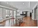 Basement game room with a ping pong table, hardwood floors, and a wet bar for entertaining guests at 602 Embassy Ct, Peachtree City, GA 30269