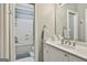 Bright bathroom featuring a tub and shower with a modern single sink vanity at 602 Embassy Ct, Peachtree City, GA 30269