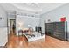 Spacious bedroom with hardwood floors, a decorated shelf, and a well-lit interior at 602 Embassy Ct, Peachtree City, GA 30269