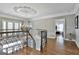 Elegant foyer with hardwood floors and ornate iron staircase at 602 Embassy Ct, Peachtree City, GA 30269