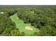 Aerial view of a meticulously maintained golf course with mature trees and sand traps at 602 Embassy Ct, Peachtree City, GA 30269