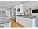 Modern kitchen features stainless steel appliances, granite countertops, and white cabinets with plenty of storage space at 602 Embassy Ct, Peachtree City, GA 30269