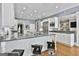 Open kitchen featuring granite countertops, stainless steel appliances, white cabinets, and an island at 602 Embassy Ct, Peachtree City, GA 30269