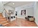 A contemporary living room with hardwood floors, accent seating and decor at 602 Embassy Ct, Peachtree City, GA 30269