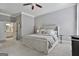 Large main bedroom featuring neutral tones, carpet flooring, and a view of the bath at 602 Embassy Ct, Peachtree City, GA 30269