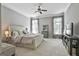 Spacious bedroom with a ceiling fan, sitting area and natural light at 602 Embassy Ct, Peachtree City, GA 30269