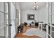 Bright office space with french doors, natural light, hardwood floors, and horse themed decor for a classic touch at 602 Embassy Ct, Peachtree City, GA 30269