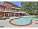Brick home with a private swimming pool and patio area, perfect for outdoor entertaining and relaxation at 602 Embassy Ct, Peachtree City, GA 30269