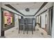 Custom theater room with a projector, tiered seating, and adjacent bar area at 602 Embassy Ct, Peachtree City, GA 30269
