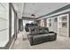 A finished theater room with tiered seating, projector, and built-in shelving at 602 Embassy Ct, Peachtree City, GA 30269
