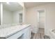 Bathroom features granite countertops, vanity, and a view into the closet at 285 Limestone Circle, Conyers, GA 30013