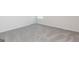 Neutral bedroom featuring a carpeted floor, white trim, a window, and an interior door at 285 Limestone Circle, Conyers, GA 30013