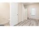 Well-lit hallway with modern vinyl flooring, offering a clean and inviting entrance at 285 Limestone Circle, Conyers, GA 30013