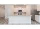 Bright kitchen island with granite countertops, stainless appliances and lots of cabinet space at 285 Limestone Circle, Conyers, GA 30013