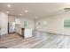 Bright kitchen and living area with stainless appliances, laminate floors and outdoor access at 285 Limestone Circle, Conyers, GA 30013