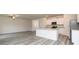 Open-concept kitchen with stainless steel appliances and an island with granite countertops at 285 Limestone Circle, Conyers, GA 30013