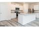 Well-appointed kitchen featuring granite countertops, stainless steel appliances and island seating at 285 Limestone Circle, Conyers, GA 30013