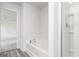 Bathroom featuring a soaking tub and a walk-in shower at 315 Limestone Circle, Conyers, GA 30013