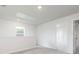 A bedroom with a large window, neutral walls and gray carpet creates a calm, inviting atmosphere at 315 Limestone Circle, Conyers, GA 30013