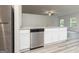 Modern kitchen featuring stainless steel appliances, granite countertops, and a stylish island overlooking the living space at 315 Limestone Circle, Conyers, GA 30013