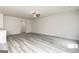 Bright living room showcasing modern flooring, a ceiling fan, and neutral wall paint at 315 Limestone Circle, Conyers, GA 30013