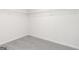 An empty walk-in closet with wire shelving and plush carpeting, maximizing storage at 315 Limestone Circle, Conyers, GA 30013