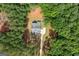 Bird's eye view of the home shows architectural details and its wooded surroundings, providing a sense of privacy and seclusion at 4731 H D Atha Rd, Covington, GA 30014