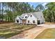 Beautifully crafted home with board and batten siding, contrasting trim, a well-manicured lawn, and private driveway at 4731 H D Atha Rd, Covington, GA 30014