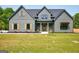 Charming craftsman-style home with a well-manicured lawn and inviting front porch at 4731 H D Atha Rd, Covington, GA 30014