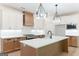 Bright kitchen featuring custom cabinetry, a center island, and stainless steel appliances at 4731 H D Atha Rd, Covington, GA 30014