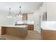 Modern kitchen boasts an island, stainless steel appliances, and stylish pendant lighting at 4731 H D Atha Rd, Covington, GA 30014