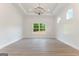 Bright living room with hardwood floors, large windows, a modern chandelier, and white walls at 4731 H D Atha Rd, Covington, GA 30014
