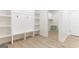 Mudroom with built-in storage, hooks, bench, and access to the laundry room at 4731 H D Atha Rd, Covington, GA 30014