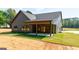 Rear exterior view featuring a covered patio, showcasing the home's outdoor living space at 4731 H D Atha Rd, Covington, GA 30014