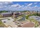 An aerial view captures a commercial area featuring a beautiful pond and parking lots at 4985 Rolling Rock Dr., Sugar Hill, GA 30518