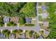 A top down aerial view of a suburban neighborhood with well-maintained yards in Sugar Hill, Georgia at 4985 Rolling Rock Dr., Sugar Hill, GA 30518